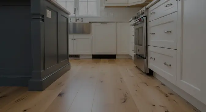 do you put flooring under kitchen cabinets